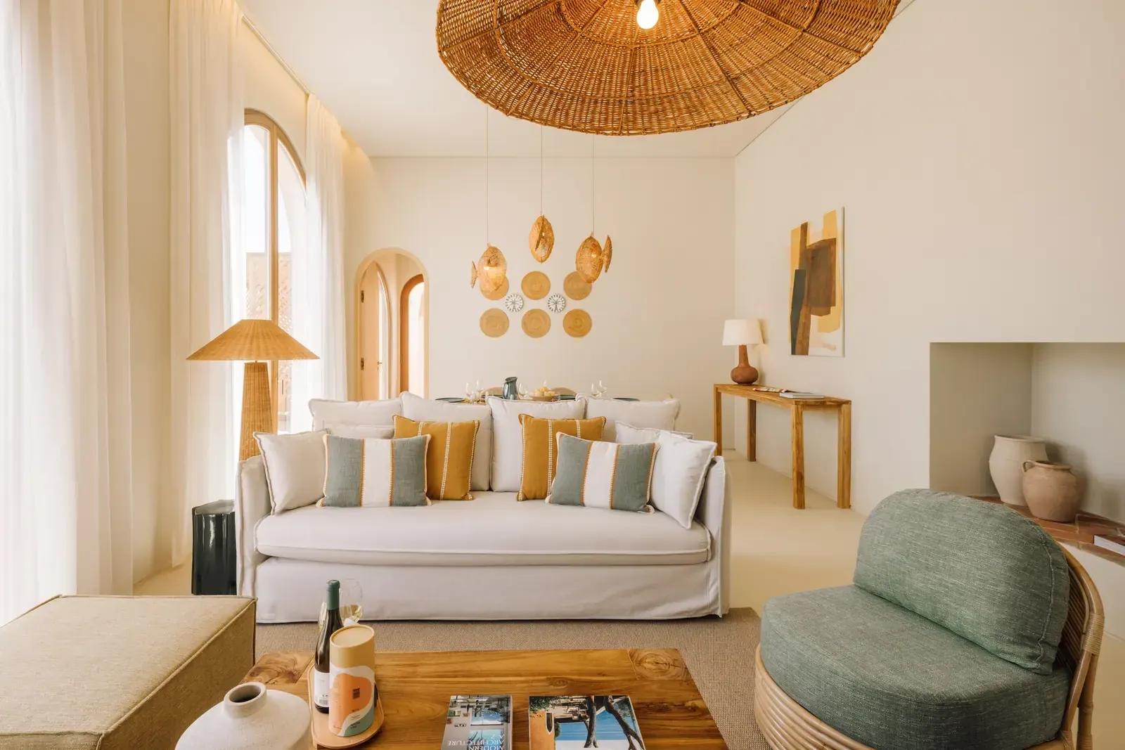 Living room with a linen sofa and woven pendant lights